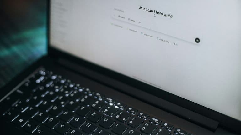 Laptop screen showing an AI assistant chat interface