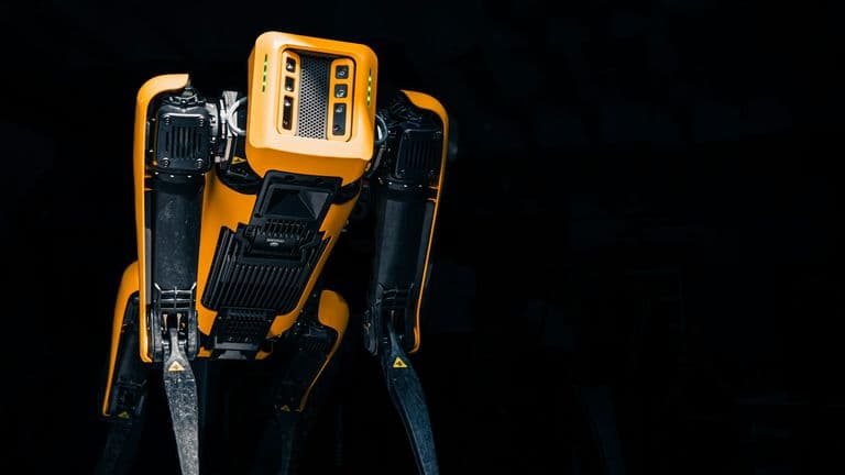 A robot standing alone in the dark, symbolizing the uncertain future of advanced AI